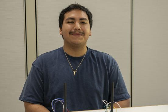 Picture of Eriberto Salgado with his project in front of him