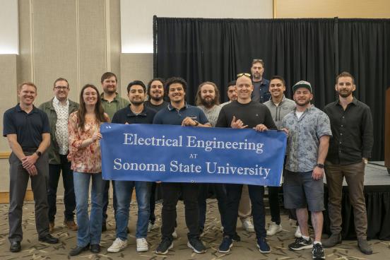 A group picture of Engineering alumni after the senior design expo