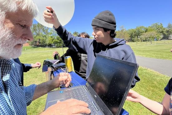Picture of professor Rob Rowlands along with students preparing the balloon for launch