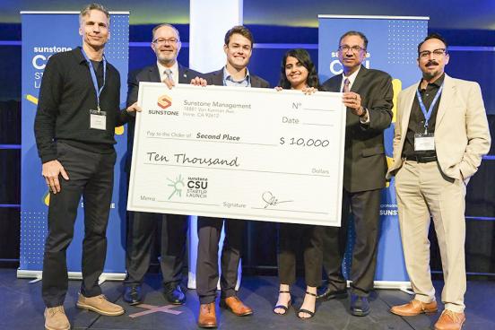 ECE Student Sokiyna Naser, 3rd from the Right, Along with Conor Seal, 4th from the Right, Receive Their Award
