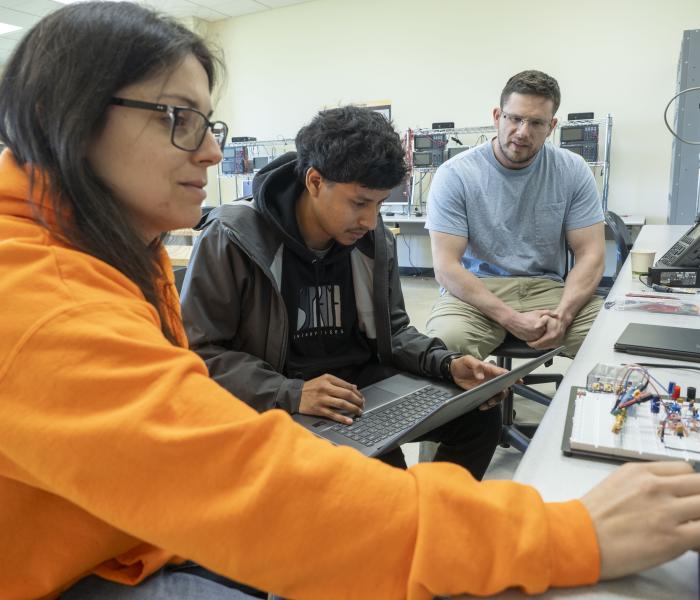 Picture of students working on their project