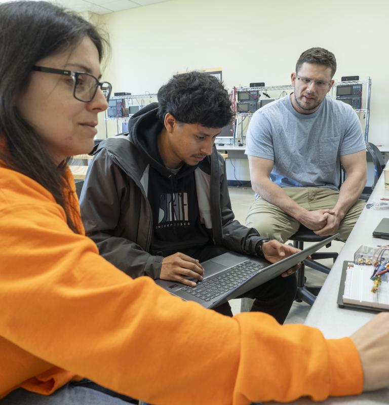 Picture of students working on their project