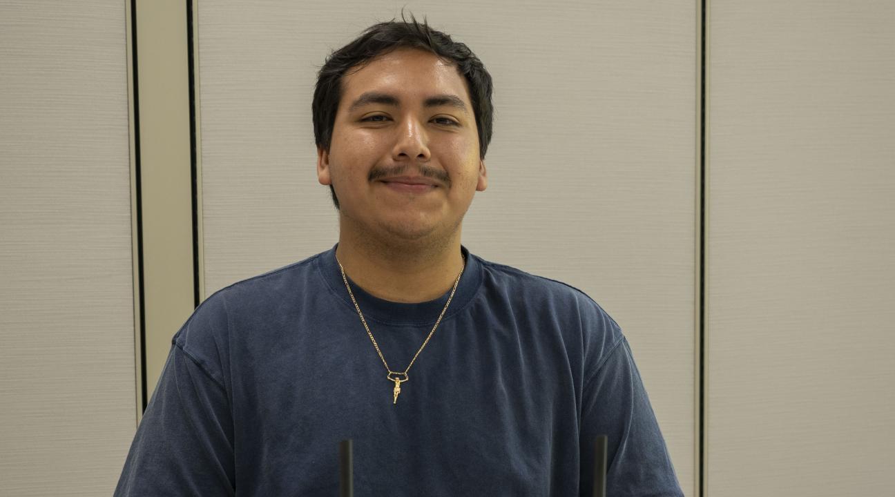 Picture of Eriberto Salgado with his project in front of him