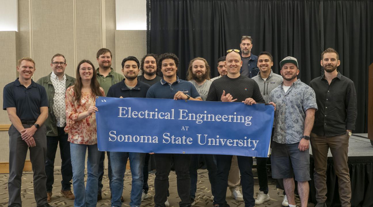 A group picture of Engineering alumni after the senior design expo