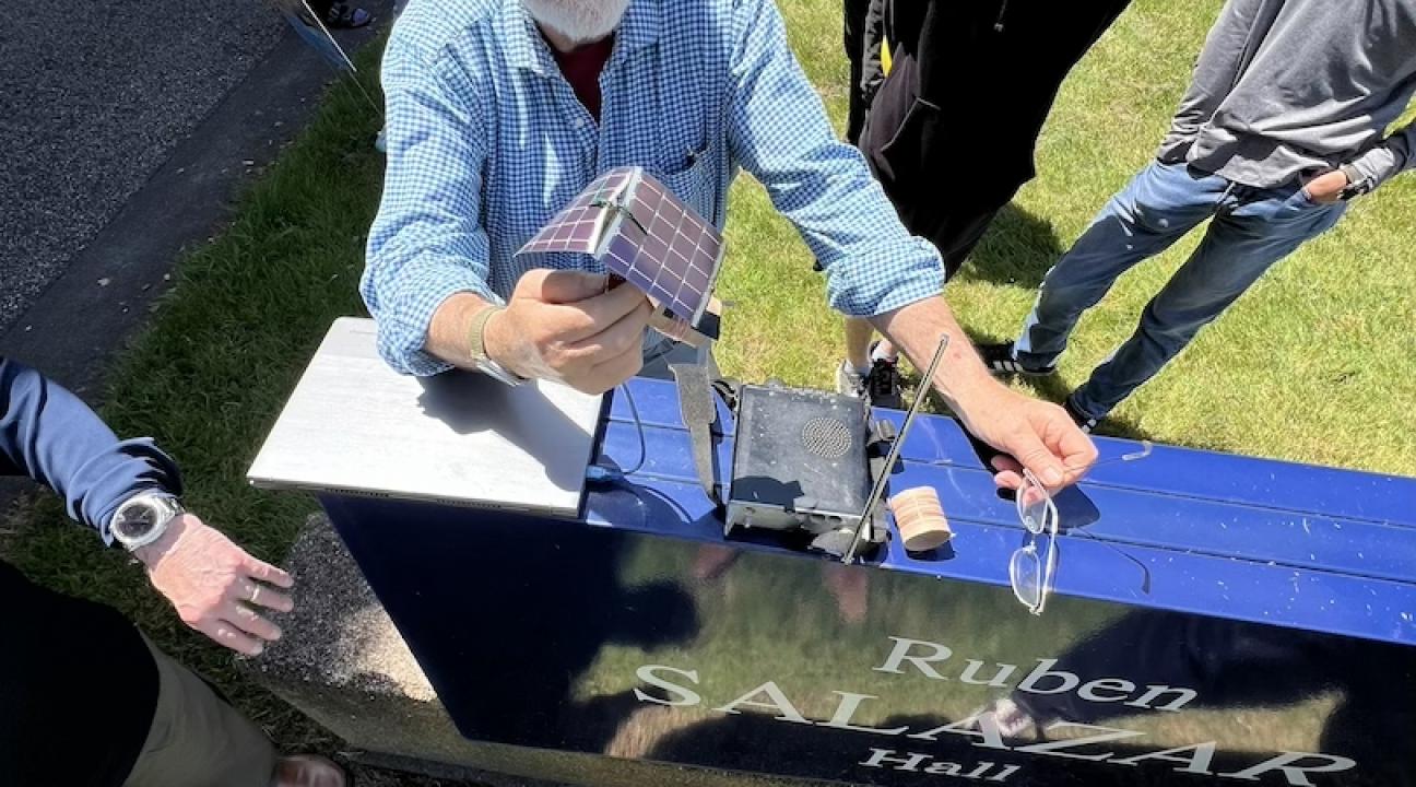 Picture of professor Rob Rowlands along with students preparing the balloon for launch