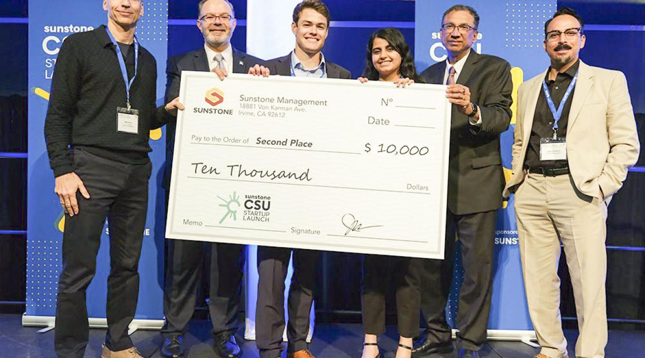 ECE Student Sokiyna Naser, 3rd from the Right, Along with Conor Seal, 4th from the Right, Receive Their Award