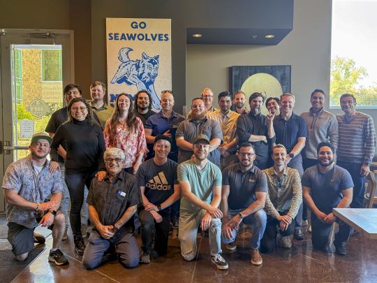 Another group picture of Engineering alumni after the senior design expo