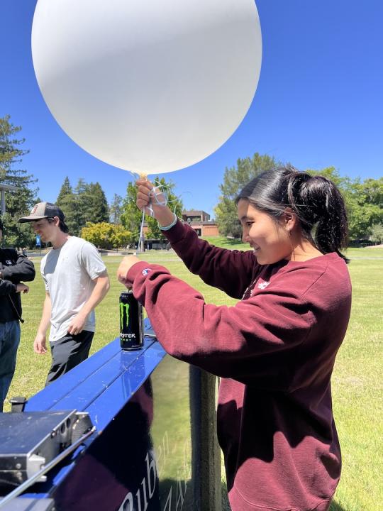 Picture of students preparing the balloon for launch